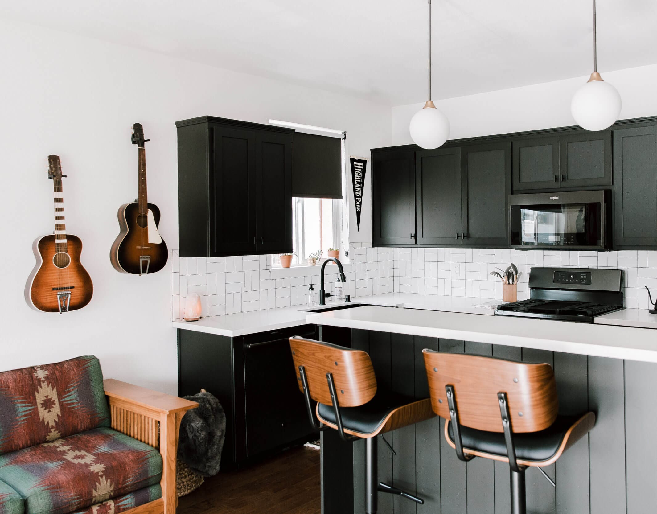 Modern designed kitchen with guitars on the wall