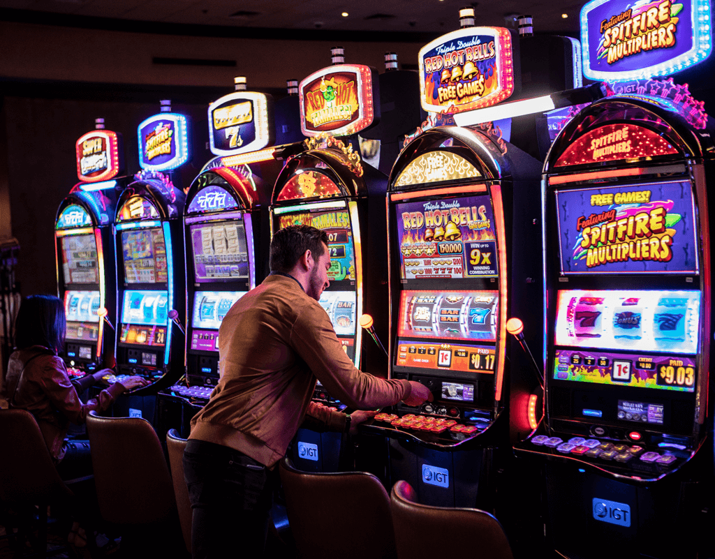 a man playing slots at win-river casino in redding ca